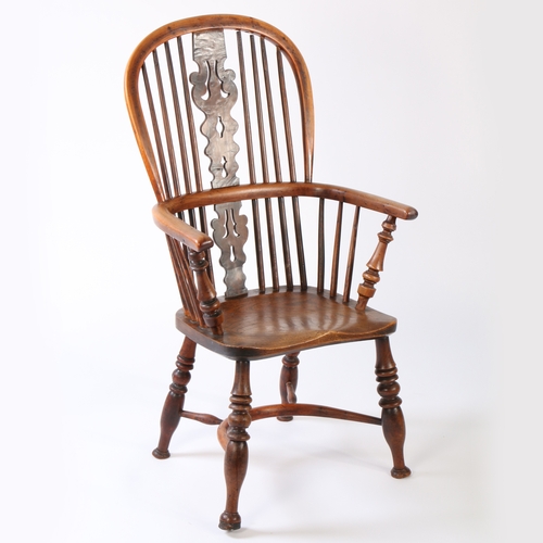 362 - A 19th century yew and elm Windsor armchair, Nottinghamshire, circa 1830

 The hooped back with four... 