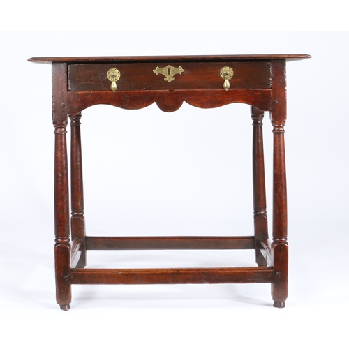 369 - A small George I oak, fruitwood and walnut side table, circa 1720

The twin-plank ovolo-moulded top ... 