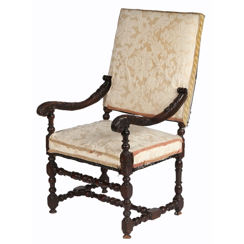 370 - An early 18th century carved walnut and upholstered open armchair, Franco-Flemish, circa 1700-20

 T... 