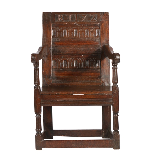 375 - A Charles II oak panel-back open armchair, dated '72'

 The back of two horizontal panels, each bold... 