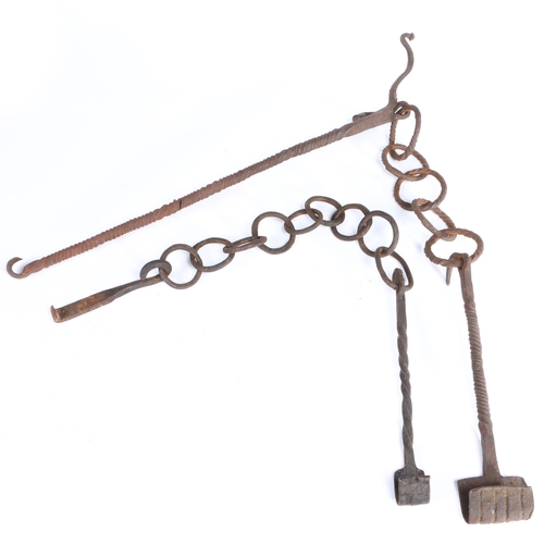 393 - Two iron pot hangers, possibly 17th century

 Each with a twist-work rod, scroll-over hook end, nume... 