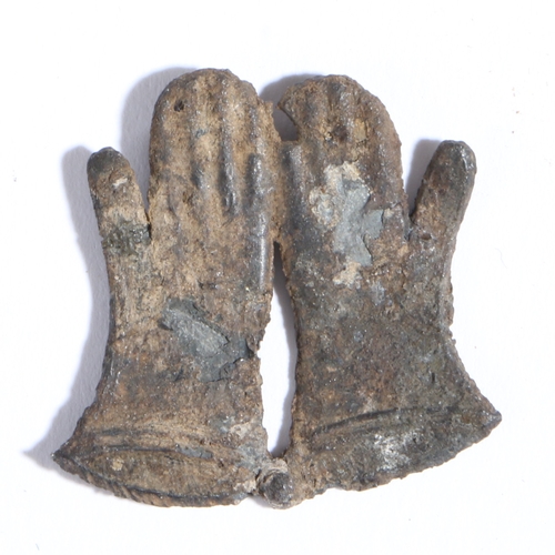 4 - A 14th century pewter pilgrim badge, St. Thomas Beckets gloves

 The pair of gauntlet-like gloves l... 