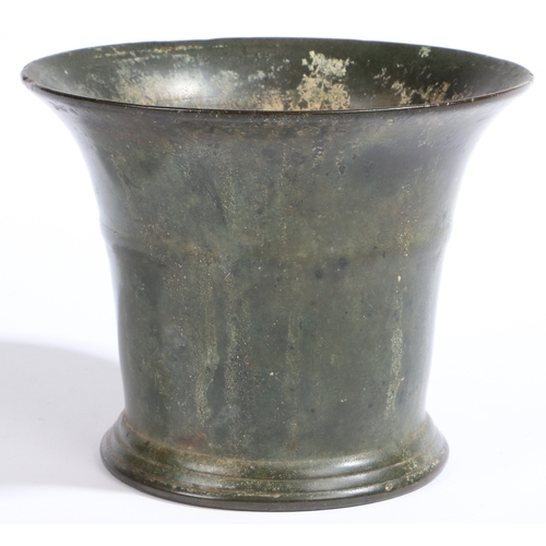 400 - An early 18th century bronze-alloy mortar, English, circa 1700

 Of flared form, with single high fi... 