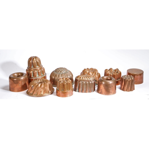 407 - A group of ten 19th century and later copper jelly moulds, English

 To include lobed, fluted turret... 