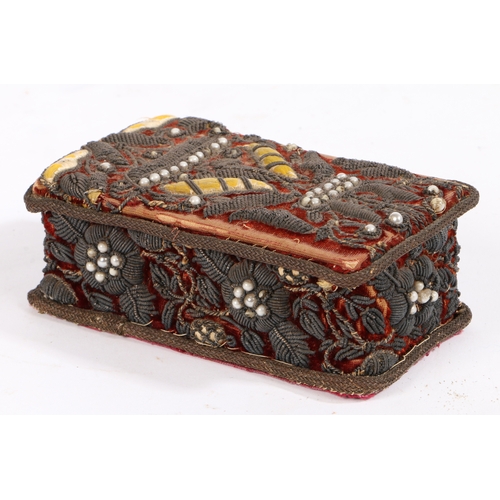 409 - A small stumpwork casket

 Designed with foliate beaded decoration, 13cm wide, 7.5cm deep, 5cm high