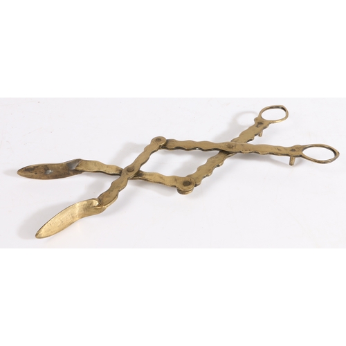 418 - A pair of early 19th century brass lazy-tongs, English

 Of extending and retracting scissor form,... 