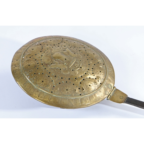 441 - A rare 17th century brass and wrought iron warming pan

 The pierced lid with rampant lions either s... 