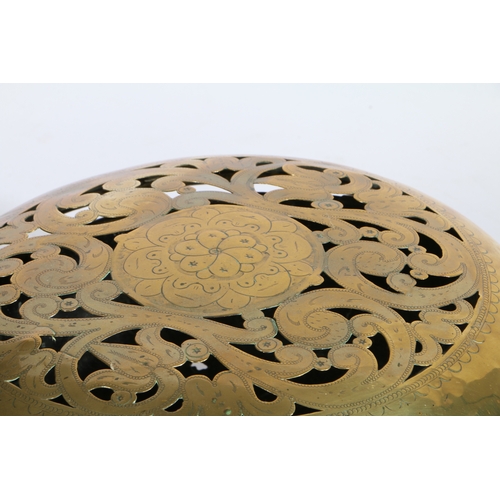 443 - An early 18th century brass and oak warming pan, Dutch

 Having a domed, floral pierced and engraved... 