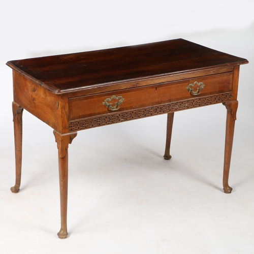 447 - A 18th century elm side table

 Having a rectangular cross-banded top, above a single drawer, with a... 