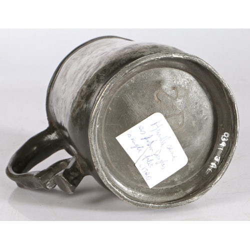 45 - A George II pewter pint U-shaped mug, attributed to Wigan, circa 1740

 Having a simple lip above a ... 