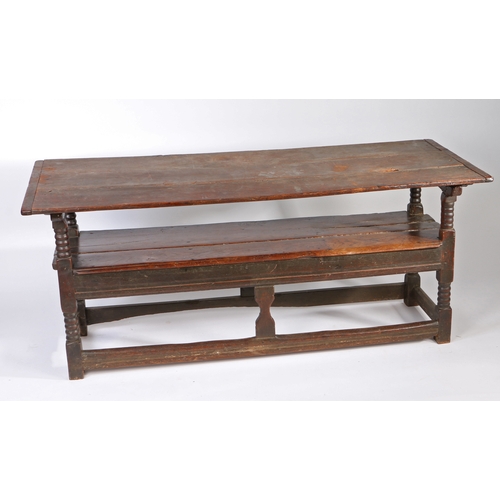 450 - A Charles II oak table-settle, circa 1680

 Having a boarded and end-cleated back/top, on four ball-... 