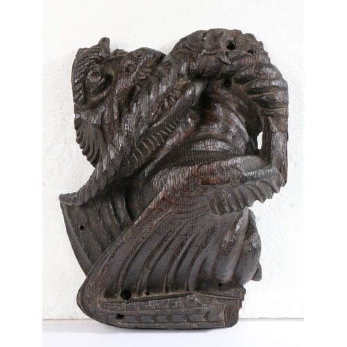 458 - A rare 15th century oak dragon-carved boss, English, circa 1400

 The snarling, winged beast clenchi... 