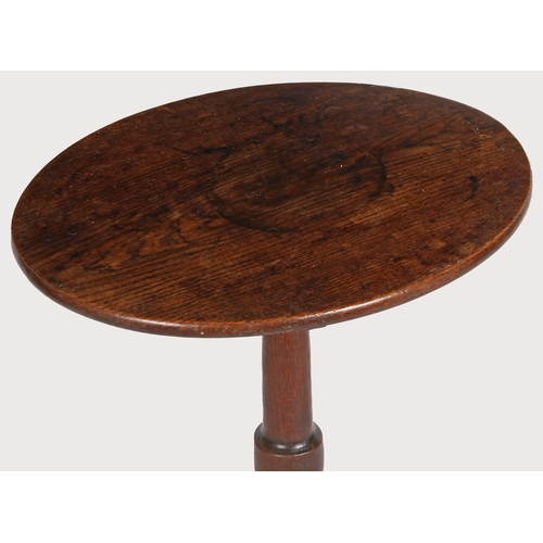 495 - A George III oak tripod occasional table, circa 1780

 Having a tilt-action, oval, one-piece top, a ... 