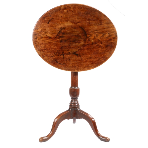 496 - A George III ash and oak tripod table, circa 1780

 Having a fixed, one-piece, circular ash top, on ... 