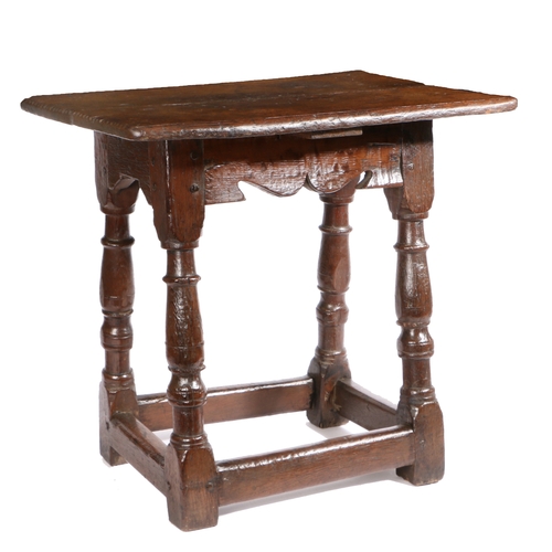 497 - A Charles I oak table-stool, West Country, circa 1640

 Having a twin-boarded top, with double-reede... 