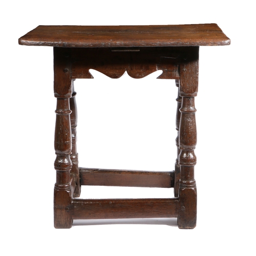 497 - A Charles I oak table-stool, West Country, circa 1640

 Having a twin-boarded top, with double-reede... 