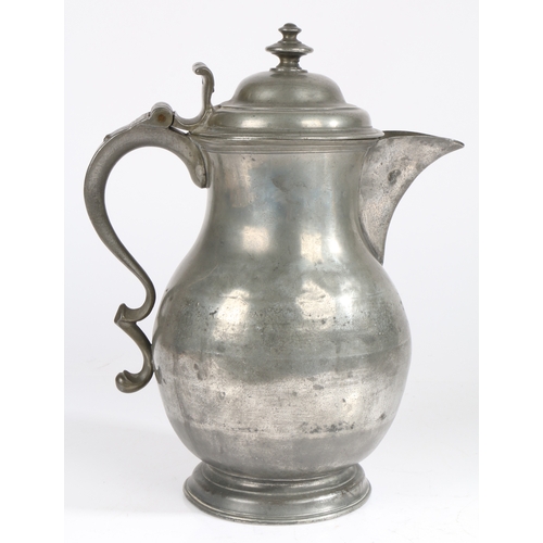 50 - A mid-18th century pewter baluster-shaped laver/flagon, circa 1750

 Having a domed lid with two-tie... 