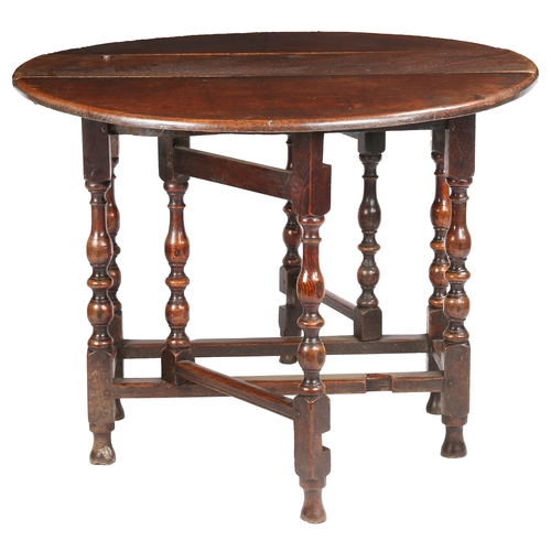 514 - A William & Mary oak gateleg table, circa 1690

 Having an oval drop-leaf top, formed mainly from br... 