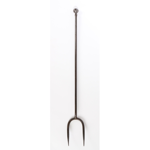 517 - A good and heavy George III wrought iron log fork, circa 1800

 Of two tines, and having a long stem... 