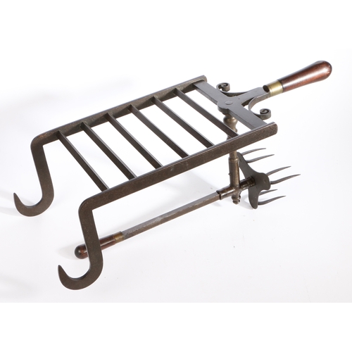 519 - A fine George III iron bar grate lark-spit, circa 1790

 The cooking prongs moving backwards and for... 