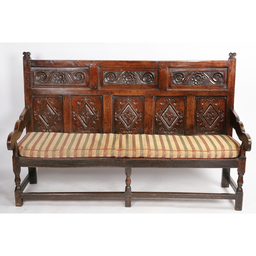 520 - A good and interesting Charles II oak settle, South-West Yorkshire, circa 1670

 The back of three h... 