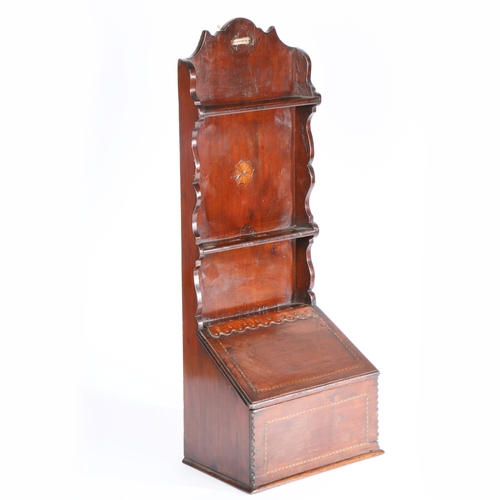 653 - A 19th century pine and inlaid spoon rack

 The slender one-piece backboard centre by an inlaid pate... 
