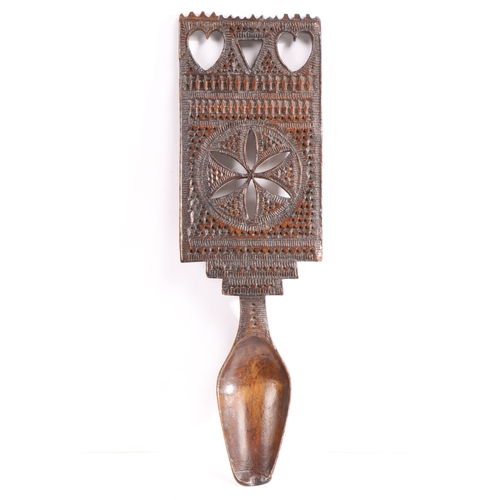 713 - A rare carved fruitwood love spoon, North Wales, circa 1830-40

 The large rectangular handle chip-c... 