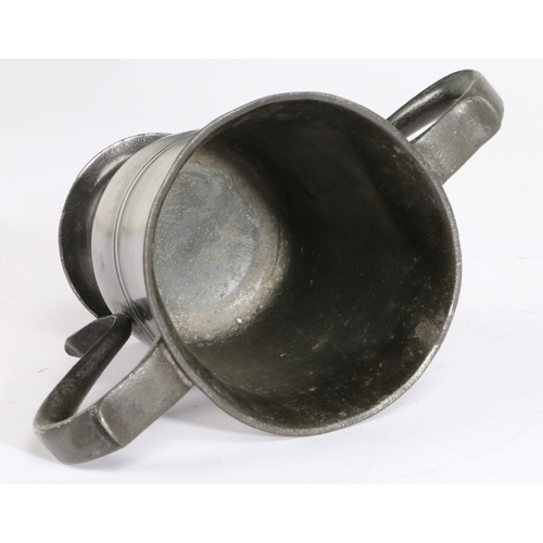 78 - A George II pewter OEWS pint twin-handled footed cup, Yorkshire, circa 1735

 Having a relatively sl... 