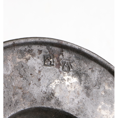 99 - A rare 16th century pewter broad rim saucer, English, circa 1500-50

 The rim with raised rolled e... 