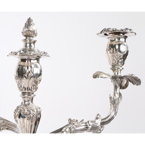 3 - A post-Regency Old Sheffield Plate four-piece table lighting suite, comprising of a pair of three-li... 