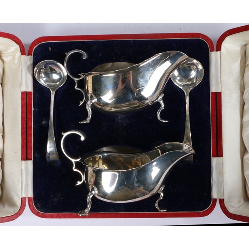 33 - A pair of George V silver sauce boat and sauce ladles, Sheffield 1925, maker Martin Hall & Co Ltd. t... 