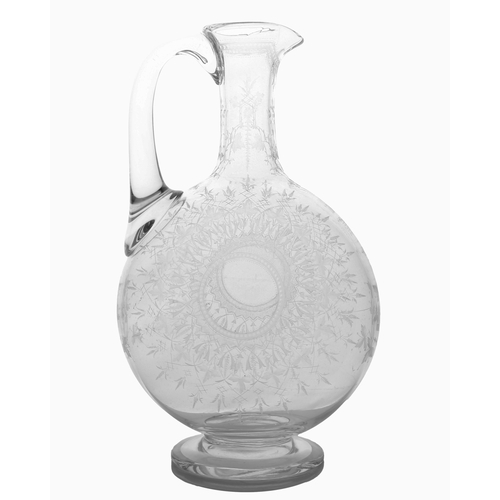 54 - A Victorian English glass claret jug, possibly by Thomas Webb, finely engraved with leaves and star ... 