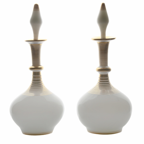 55 - A pair of French mid 19th Century white opaline perfume decanters, circa 1850, with gilded ring deco... 