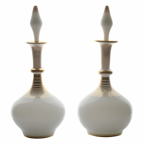 55 - A pair of French mid 19th Century white opaline perfume decanters, circa 1850, with gilded ring deco... 