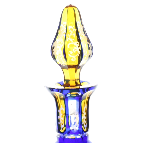 58 - A good 19th Century Bohemian glass decanter, in blue and yellow with scrolling leaf and flower decor... 