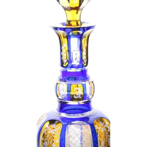 58 - A good 19th Century Bohemian glass decanter, in blue and yellow with scrolling leaf and flower decor... 