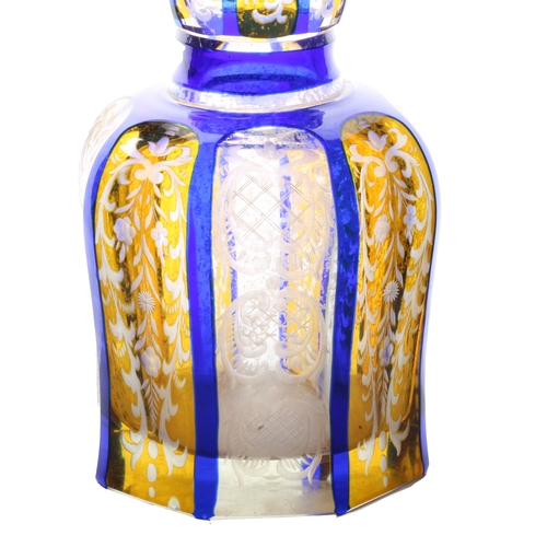 58 - A good 19th Century Bohemian glass decanter, in blue and yellow with scrolling leaf and flower decor... 