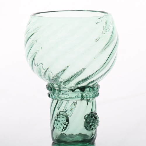 61 - An English 18th Century green roemer glass, circa 1700, the wrythen cup with multi applied raspberry... 