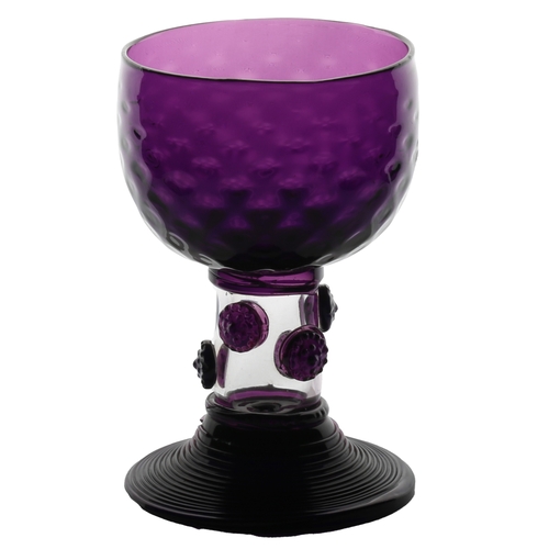 62 - An English 19th Century amethyst roemer glass, circa 1830, the cup with multi applied raspberry prun... 