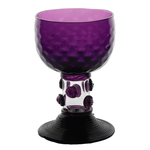 62 - An English 19th Century amethyst roemer glass, circa 1830, the cup with multi applied raspberry prun... 