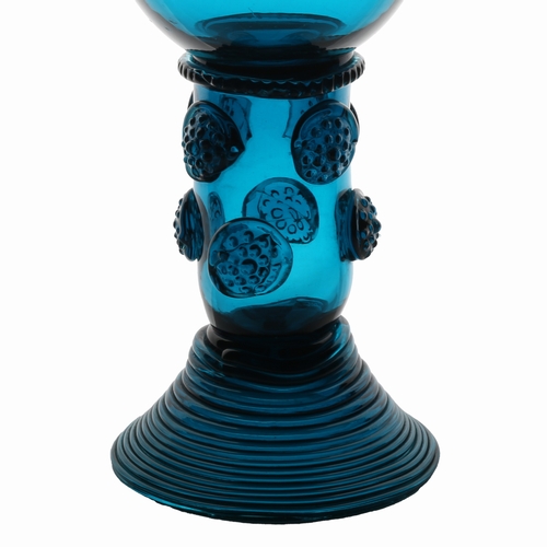 63 - An English 18th Century blue roemer glass, circa 1770, the tall cup with multi applied raspberry pru... 