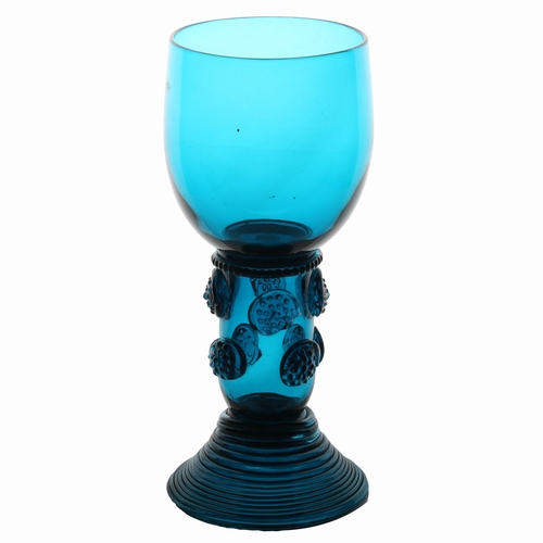 63 - An English 18th Century blue roemer glass, circa 1770, the tall cup with multi applied raspberry pru... 