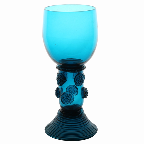 63 - An English 18th Century blue roemer glass, circa 1770, the tall cup with multi applied raspberry pru... 