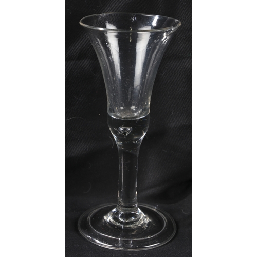 66 - An English plain stem trumpet wine goblet, c.1750 18.5cm high, together with a further example (2)