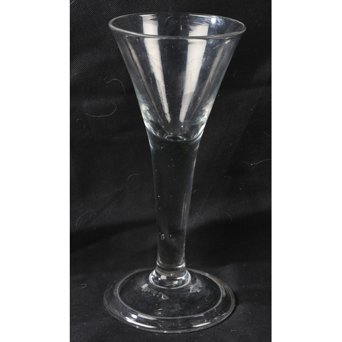 66 - An English plain stem trumpet wine goblet, c.1750 18.5cm high, together with a further example (2)