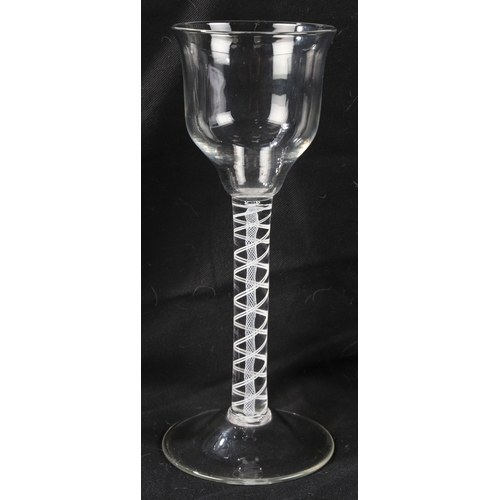 67 - A pair of Georgian wine glasses, c.1760 the ogee bowls over an opaque twist stem 21cm high (2)