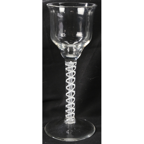 67 - A pair of Georgian wine glasses, c.1760 the ogee bowls over an opaque twist stem 21cm high (2)