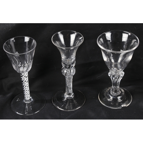 68 - A Georgian air twist stem wine glass16cm high together with two further Georgian glasses, all with c... 