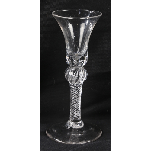 68 - A Georgian air twist stem wine glass16cm high together with two further Georgian glasses, all with c... 