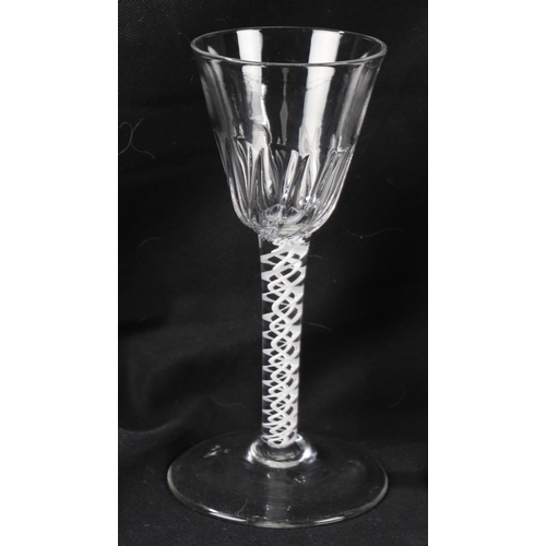 68 - A Georgian air twist stem wine glass16cm high together with two further Georgian glasses, all with c... 